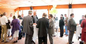 People talking at a dinner reception