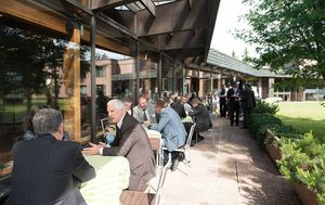 People enjoying a sunny coffee break on a terrace