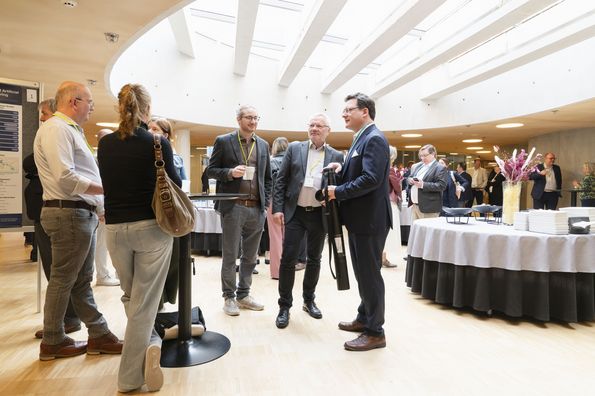 Conference participants talking during a break