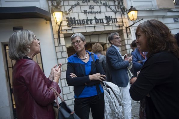 Conference participants talking in front of the wine museum at the start of the evening reception