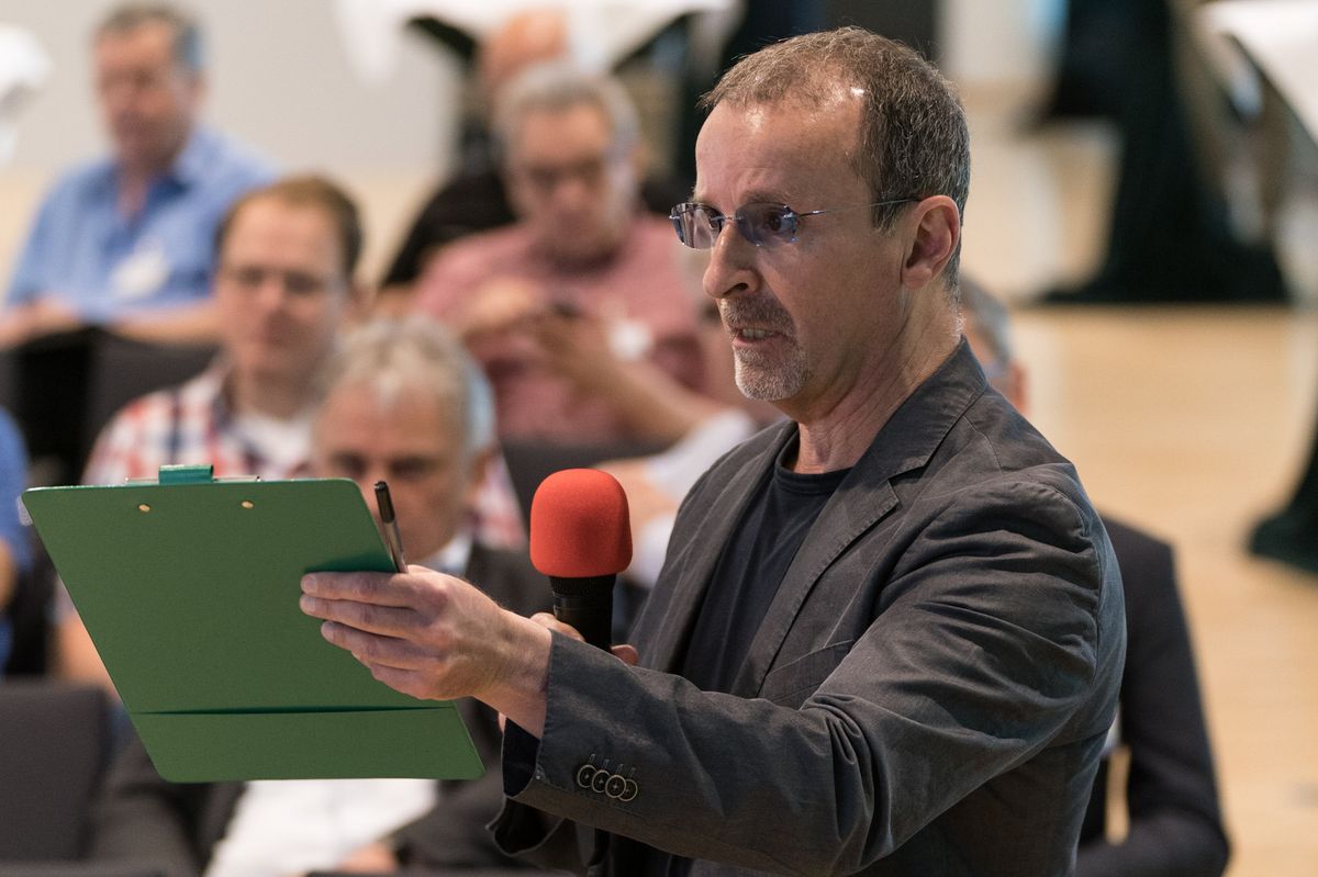 Stefano Boy asking a question from the audience during the panel discussion