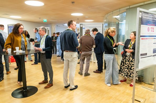 People discussing during poster session