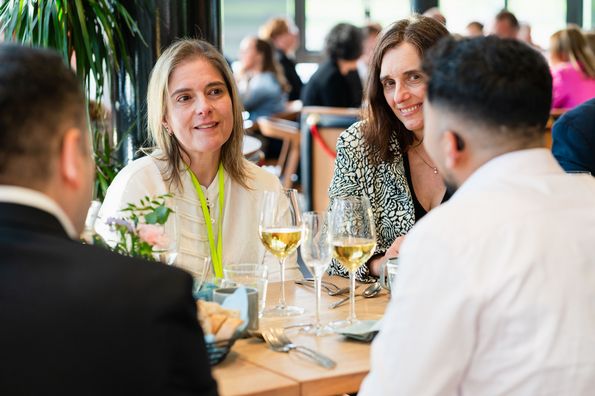 People talking during conference dinner