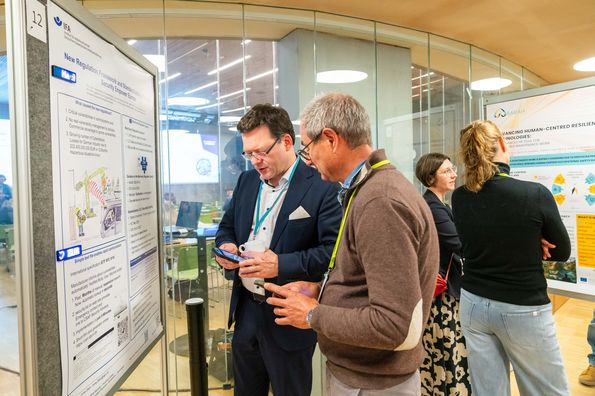 People discussing during poster session