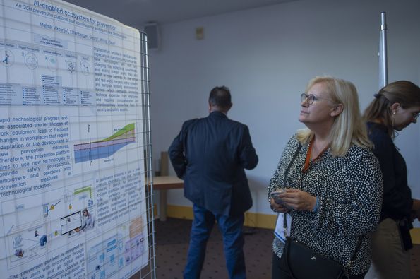 Conference delegates looking at the poster exhibition